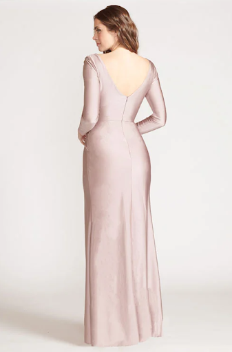 a light pink bridesmaid dress on brunette model for a winter wedding
