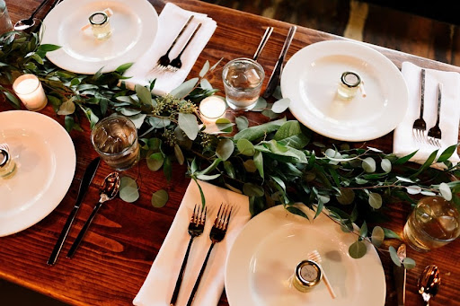 a table setup with nature for a winter wedding theme